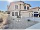 Charming two-story home with a two-car garage and desert landscaping at 20436 N 17Th Pl, Phoenix, AZ 85024