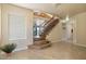 Bright foyer with tile flooring, staircase, and clear view of living space at 20436 N 17Th Pl, Phoenix, AZ 85024