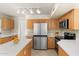 Modern kitchen with stainless steel appliances and white countertops at 20436 N 17Th Pl, Phoenix, AZ 85024