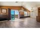 Spacious living room with sliding door access to balcony and custom billiard themed light at 20436 N 17Th Pl, Phoenix, AZ 85024