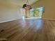 Well-lit living room showcasing hardwood floors and a slider leading to outdoor space at 20436 N 17Th Pl, Phoenix, AZ 85024