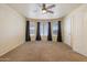 Large main bedroom featuring soft carpet, a ceiling fan and a bay window at 20436 N 17Th Pl, Phoenix, AZ 85024