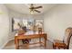 Sunlit home office with large desk and comfortable chairs at 20436 N 17Th Pl, Phoenix, AZ 85024