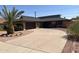 Ranch-style home with a large driveway and mature landscaping at 3325 W Belmont Ave, Phoenix, AZ 85051