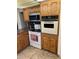 Kitchen featuring built-in oven, microwave and stove top at 3325 W Belmont Ave, Phoenix, AZ 85051