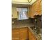 Kitchen with granite countertops and wood cabinets at 3325 W Belmont Ave, Phoenix, AZ 85051