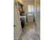 Laundry room with washer, dryer, and shelving for storage at 3325 W Belmont Ave, Phoenix, AZ 85051