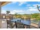 Outdoor patio with built-in grill and dining area overlooking pool at 34704 N 93Rd Pl, Scottsdale, AZ 85262