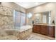 Elegant bathroom with a soaking tub and walk-in shower at 34704 N 93Rd Pl, Scottsdale, AZ 85262