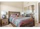 Cozy bedroom with rustic wood bed frame and southwestern decor at 34704 N 93Rd Pl, Scottsdale, AZ 85262