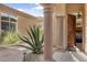 Private courtyard access with a large agave plant and stone pathway at 34704 N 93Rd Pl, Scottsdale, AZ 85262