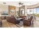 Relaxing living room featuring a stone fireplace and hardwood floors at 34704 N 93Rd Pl, Scottsdale, AZ 85262