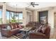 Bright living room with leather furniture and scenic views at 34704 N 93Rd Pl, Scottsdale, AZ 85262