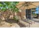 Peaceful patio with lounge chairs and umbrella for relaxing at 34704 N 93Rd Pl, Scottsdale, AZ 85262