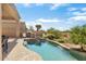 Relaxing freeform pool and patio with built-in grill at 34704 N 93Rd Pl, Scottsdale, AZ 85262