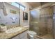 Elegant bathroom featuring granite counters, decorative tile, and a glass-enclosed shower at 37615 N Tranquil Trl, Carefree, AZ 85377