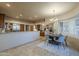 Spacious dining area features a modern chandelier and bay window at 37615 N Tranquil Trl, Carefree, AZ 85377