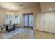 Dining area with modern light fixture, bay windows, and a built-in cabinet at 37615 N Tranquil Trl, Carefree, AZ 85377