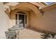 Welcoming front entrance with a cozy seating area and beautiful desert landscaping at 37615 N Tranquil Trl, Carefree, AZ 85377