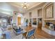 Elegant living room with tray ceiling, hardwood floors, and inviting seating area at 37615 N Tranquil Trl, Carefree, AZ 85377