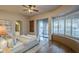 Light-filled main bedroom with hardwood floors, a bay window, and private access to the backyard at 37615 N Tranquil Trl, Carefree, AZ 85377