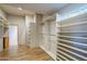 Organized walk-in closet featuring custom shelving and plenty of room for storage at 37615 N Tranquil Trl, Carefree, AZ 85377