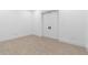 An empty bedroom with new tile floor and white walls at 42140 N Golden Trl, San Tan Valley, AZ 85140