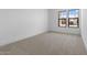 Vacant bedroom with new carpet, and bright natural light at 42140 N Golden Trl, San Tan Valley, AZ 85140