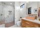 Modern bathroom with a coral sink, glass shower, and herringbone tile at 6229 E Gold Dust Ave, Paradise Valley, AZ 85253