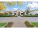 Stunning curb appeal featuring a white two-story home with a brick walkway at 6229 E Gold Dust Ave, Paradise Valley, AZ 85253