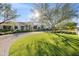 Stunning home with lush lawn, curved driveway, and mature trees at 6229 E Gold Dust Ave, Paradise Valley, AZ 85253