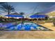 Inviting pool area with floating loungers, umbrellas, and plenty of lounge space at 6229 E Gold Dust Ave, Paradise Valley, AZ 85253