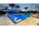 Expansive pool with swim-up bar, lighting, and lounge chairs at 6229 E Gold Dust Ave, Paradise Valley, AZ 85253