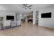 Living room with an open view of the kitchen, creating a spacious and welcoming atmosphere at 1057 W Chimes Tower Dr, Casa Grande, AZ 85122