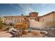 Spanish style home with courtyard entry and desert landscaping at 11461 S Wilson Ln, Goodyear, AZ 85338