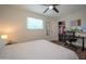 Bright bedroom with hardwood floors, ceiling fan, and walk-in closet at 1721 S Shafer Dr, Tempe, AZ 85281