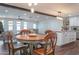 Bright and airy dining area with a white kitchen and wooden table at 1721 S Shafer Dr, Tempe, AZ 85281