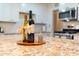 Kitchen detail showing granite countertop with wine bottles and candle at 1721 S Shafer Dr, Tempe, AZ 85281