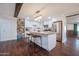 Modern kitchen with white shaker cabinets, granite countertops, and stainless steel appliances at 1721 S Shafer Dr, Tempe, AZ 85281