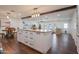 Open concept kitchen with island, looking into the living and dining areas at 1721 S Shafer Dr, Tempe, AZ 85281