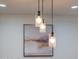 Three glass pendant lights above kitchen island at 1721 S Shafer Dr, Tempe, AZ 85281