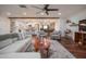 Open living room featuring hardwood floors, comfy seating, and a view into the updated kitchen at 1721 S Shafer Dr, Tempe, AZ 85281