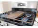 Stainless steel gas stove with griddle at 1721 S Shafer Dr, Tempe, AZ 85281