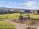 Community playground with mountain views, walking path, and community homes at 17731 W Elm St, Goodyear, AZ 85395