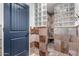 Spa-like bathroom with glass block shower and stone tile at 26223 N Bravo Ln, Rio Verde, AZ 85263