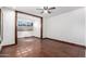 Bright bedroom with terracotta tile floors and ceiling fan at 26223 N Bravo Ln, Rio Verde, AZ 85263