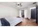 Bedroom with tile floors, ceiling fan, and sliding door to patio at 26223 N Bravo Ln, Rio Verde, AZ 85263