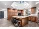 Spacious kitchen with island, granite countertops, and wooden cabinets at 26223 N Bravo Ln, Rio Verde, AZ 85263