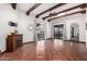 Living room with high ceilings, exposed beams, and tile floors at 26223 N Bravo Ln, Rio Verde, AZ 85263