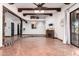 Living room with decorative columns, wood beams, and tile floors at 26223 N Bravo Ln, Rio Verde, AZ 85263